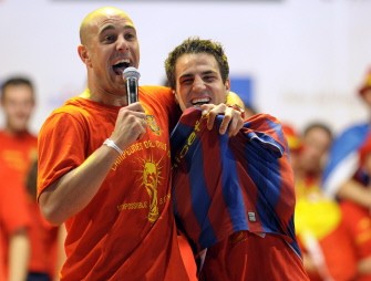 AFP - This file picture dated July 12, 2010 shows Spain's goalkeeper Pepe Reina (L) and Spain's midfielder Cesc Fabregas (R), wearing a Barcelona's jersey, celebratin on a stage set up for the Spanish team victory ceremony in Madrid one day after they won the 2010 FIFA football World Cup match against the Netherlands in Johannesburg. AFP - This file picture dated July 12, 2010 shows Spain's goalkeeper Pepe Reina (L) and Spain's midfielder Cesc Fabregas (R), wearing a Barcelona's jersey, celebratin on a stage set up for the Spanish team victory ceremony in Madrid one day after they won the 2010 FIFA football World Cup match against the Netherlands in Johannesburg.