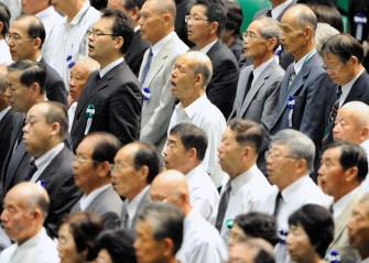 AFP - People sing Japan's national anthem during a memorial service for the victims of World War II in Tokyo on August 15, 2011 AFP - People sing Japan's national anthem during a memorial service for the victims of World War II in Tokyo on August 15, 2011