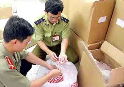Market management officials check smuggled food supplements