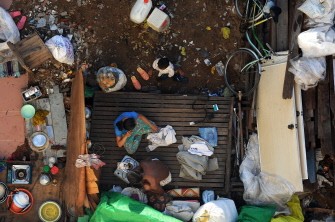 AFP - A Cambodian family sits on a bed near the Boeung Kak lake in central Phnom Penh on August 16, 2011. AFP - A Cambodian family sits on a bed near the Boeung Kak lake in central Phnom Penh on August 16, 2011.