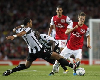 AFP - Arsenal's Aaron Ramsey (R) is challenged by Udinese's Morrocan player Mehdi Benatia (L) during their game AFP - Arsenal's Aaron Ramsey (R) is challenged by Udinese's Morrocan player Mehdi Benatia (L) during their game