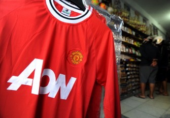 AFP - A Manchester United football jersey is display at a shop in Denpasar, Indonesia on August 17, 2011. AFP - A Manchester United football jersey is display at a shop in Denpasar, Indonesia on August 17, 2011.