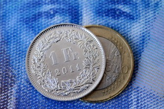 AFP - A "one Swiss franc" coin and a one-euro coin are seen on top of a 100 Swiss francs note bearing a picture of sculptor and painter Alberto Giacometti on this picture taken on August 17, 2010 in Lausanne, Switzerland AFP - A "one Swiss franc" coin and a one-euro coin are seen on top of a 100 Swiss francs note bearing a picture of sculptor and painter Alberto Giacometti on this picture taken on August 17, 2010 in Lausanne, Switzerland