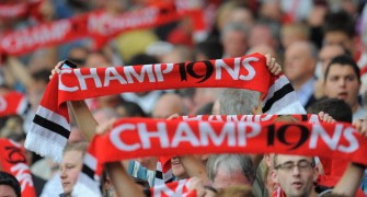 Manchester United supporters hold scarves in the air before the English Premier League football match between Manchester United and Tottenham Hotspur at Old Trafford in Manchester on August 22, 2011. AFP Manchester United supporters hold scarves in the air before the English Premier League football match between Manchester United and Tottenham Hotspur at Old Trafford in Manchester on August 22, 2011. AFP