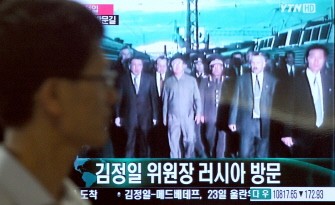 A South Korean walks past by a TV feeding file video footage of North Korean leader Kim Jong-Il's last visit to Russia in 2002 at a train station in Seoul on August 20, 2011 A South Korean walks past by a TV feeding file video footage of North Korean leader Kim Jong-Il's last visit to Russia in 2002 at a train station in Seoul on August 20, 2011
