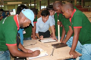 African trainees attend a training course at a wood processing plant of the Truong Thanh Furniture Corporation African trainees attend a training course at a wood processing plant of the Truong Thanh Furniture Corporation