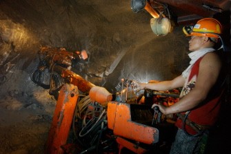 This file photo taken on May 27, 2006 shows a miner using a drill machine before blasting to extract boulders of ore in a mine tunnel some 700 meters (2,297 feet) under Mount Santo Tomas in northern Benguet province. This file photo taken on May 27, 2006 shows a miner using a drill machine before blasting to extract boulders of ore in a mine tunnel some 700 meters (2,297 feet) under Mount Santo Tomas in northern Benguet province.