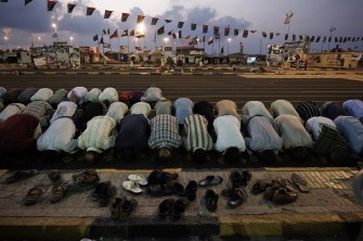 Dozens of Libyans perform the last late afternoon prayer of the Muslim holy month of Ramadan at Freedom Square in the eastern Libyan port city of Benghazi on August 29, 2011. Dozens of Libyans perform the last late afternoon prayer of the Muslim holy month of Ramadan at Freedom Square in the eastern Libyan port city of Benghazi on August 29, 2011.