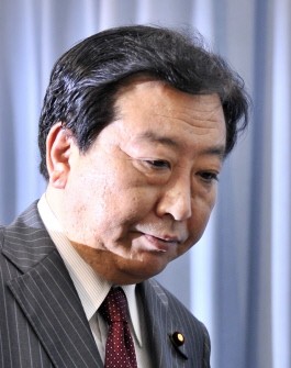 Japanese Finance Minister Yoshihiko Noda, appointed as the new prime minister leaves a press conference at his office in Tokyo on August 30, 2011 Japanese Finance Minister Yoshihiko Noda, appointed as the new prime minister leaves a press conference at his office in Tokyo on August 30, 2011