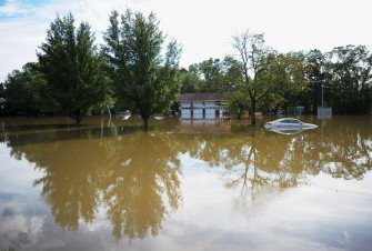 Rains and the cresting of nearby waters caused flooding in front of the Hi-Tech auto shop at Farmingdale Rd., and Pompton Plains circle on August 29, 2011 in Wayne, New Jersey. Rains and the cresting of nearby waters caused flooding in front of the Hi-Tech auto shop at Farmingdale Rd., and Pompton Plains circle on August 29, 2011 in Wayne, New Jersey.