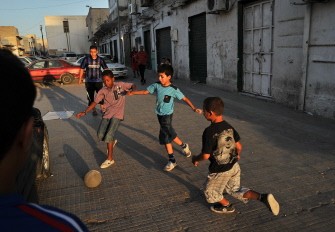 Libyan children play football at Rashid Street market in the centre of Tripoli on August 29, 2011. Libyan children play football at Rashid Street market in the centre of Tripoli on August 29, 2011.