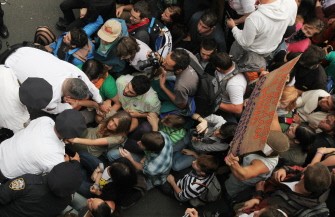 AFP - Police arrest demonstrators affiliated with the Occupy Wall Street movement after they attempted to cross the Brooklyn Bridge on the motorway on October 1, 2011 in New York City. AFP - Police arrest demonstrators affiliated with the Occupy Wall Street movement after they attempted to cross the Brooklyn Bridge on the motorway on October 1, 2011 in New York City.