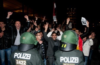 Policemen face demonstrators shouting in front of the Syrian embassy on October 8, 2011 in Berlin Policemen face demonstrators shouting in front of the Syrian embassy on October 8, 2011 in Berlin