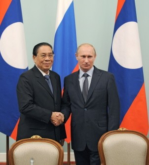 Russian Prime Minister Vladimir Putin (R) shakes hands with Laos' President Choummaly Sayasone during their meeting at the Government House in Moscow on October 13, 2011. Russian Prime Minister Vladimir Putin (R) shakes hands with Laos' President Choummaly Sayasone during their meeting at the Government House in Moscow on October 13, 2011.