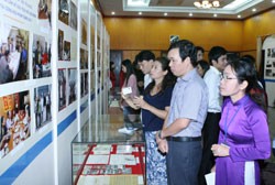 Visitors view photographs and documents in an exhibition at the presidential complex on President Ho Chi Minh's visit to France in 1946 Visitors view photographs and documents in an exhibition at the presidential complex on President Ho Chi Minh's visit to France in 1946