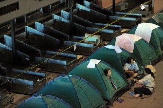 Women talk as they sit in tents at a shelter for families who fled floodwaters set up at a disused terminal building in Bangkok's second-largest airport, Don Mueang, on October 23, 2011. Women talk as they sit in tents at a shelter for families who fled floodwaters set up at a disused terminal building in Bangkok's second-largest airport, Don Mueang, on October 23, 2011.