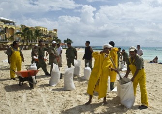 Hotel workers fill bags with sand in preparation for the arrival of Huricane Rin, in Playa del Carmen, Quintana Roo state, Mexico on October 26, 2011. Hotel workers fill bags with sand in preparation for the arrival of Huricane Rin, in Playa del Carmen, Quintana Roo state, Mexico on October 26, 2011.