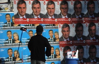AFP - A worker posts election posters of Ivailo Kalfin(R), presidential candidate of the opposition Bulgarian Socialist Party, next to posters of Rosen Plevneliev ,presidential candidate of Bulgaria's centre-right ruling GERB party in Sofia on October 28, 2011. AFP - A worker posts election posters of Ivailo Kalfin(R), presidential candidate of the opposition Bulgarian Socialist Party, next to posters of Rosen Plevneliev ,presidential candidate of Bulgaria's centre-right ruling GERB party in Sofia on October 28, 2011.