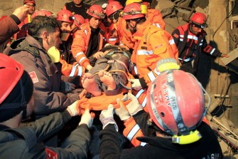 Rescuers carry a survivor from a collapsed building after an earthquake in Van, eastern of Turkey, on November 9, 2011. Rescuers carry a survivor from a collapsed building after an earthquake in Van, eastern of Turkey, on November 9, 2011.
