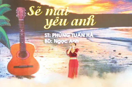 Ca sĩ Ngọc Anh thể hiện bài hát “Sẽ mãi yêu anh” - một nhạc phẩm ca ngợi tình yêu của những người bám biển do Nhạc sĩ Phùng Tuấn Hà - Tổng Giám đốc Petrosetco sáng tác. Ảnh: Diễm Quỳnh - Cầu Vồng Trắng Ca sĩ Ngọc Anh thể hiện bài hát “Sẽ mãi yêu anh” - một nhạc phẩm ca ngợi tình yêu của những người bám biển do Nhạc sĩ Phùng Tuấn Hà - Tổng Giám đốc Petrosetco sáng tác. Ảnh: Diễm Quỳnh - Cầu Vồng Trắng