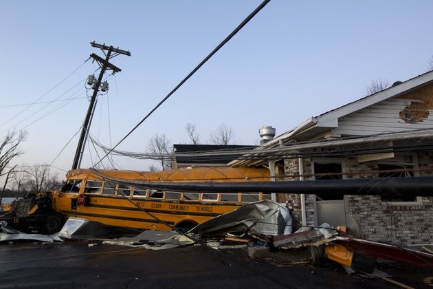 A school bus is pushed through the front of a building after a tornado swept through Henryville, Ind., Friday March 2, 2012. (AFP Photo) A school bus is pushed through the front of a building after a tornado swept through Henryville, Ind., Friday March 2, 2012. (AFP Photo)