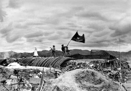 Viet Minh troops plant their flag over a captured French position Viet Minh troops plant their flag over a captured French position