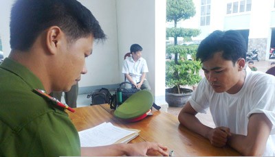 A policeman writes out a report A policeman writes out a report