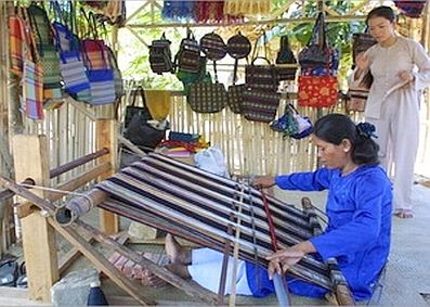 A booth in the festival displaying and demonstrating hand-made embroidered products A booth in the festival displaying and demonstrating hand-made embroidered products