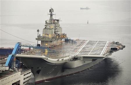 China's first aircraft carrier, which was renovated from an old aircraft carrier that China bought from Ukraine in 1998, is seen docked at Dalian Port, in Dalian, Liaoning province in this September 22, 2012. China's first aircraft carrier, which was renovated from an old aircraft carrier that China bought from Ukraine in 1998, is seen docked at Dalian Port, in Dalian, Liaoning province in this September 22, 2012.