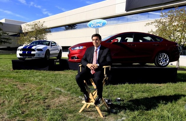 In this Sept. 10, 2012, file photo, Mark Fields, Ford president of the Americas, poses for a photo next to a 2013 Fusion at the Flat Rock Assembly in Flat Rock, Mich. In this Sept. 10, 2012, file photo, Mark Fields, Ford president of the Americas, poses for a photo next to a 2013 Fusion at the Flat Rock Assembly in Flat Rock, Mich.
