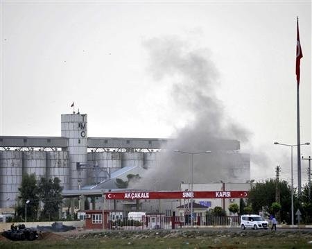 Smoke rises at the Akcakale border gate after a shell fired from Syria landed on the Turkish-Syrian border in Sanliurfa province October 7, 2012 Smoke rises at the Akcakale border gate after a shell fired from Syria landed on the Turkish-Syrian border in Sanliurfa province October 7, 2012
