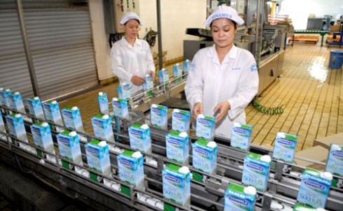 Employees at a production line inside a Vinamilk plant Employees at a production line inside a Vinamilk plant