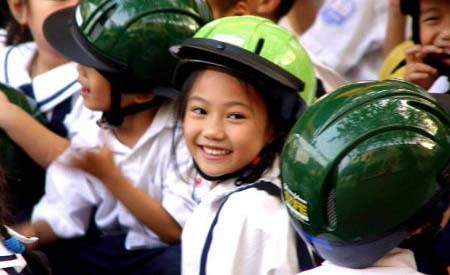 Children should wear helmet to protect them on motorbikes Children should wear helmet to protect them on motorbikes