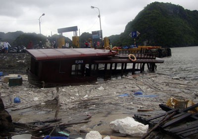 A passenger vessel anchored in Cat Ba Bay of Hai Phong City sank during Typhoon Son Tinh A passenger vessel anchored in Cat Ba Bay of Hai Phong City sank during Typhoon Son Tinh