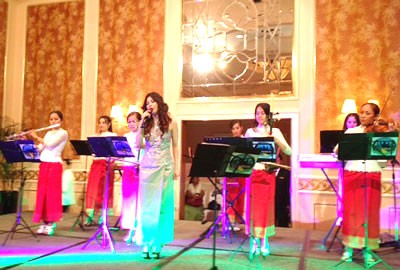 Cambodian singer Huy Syna performs a Vietnamese song at an event to launch a new bus tour between Ho Chi Minh City and Phnom Penh Cambodian singer Huy Syna performs a Vietnamese song at an event to launch a new bus tour between Ho Chi Minh City and Phnom Penh