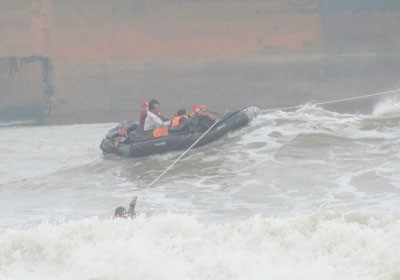 A rescue boat struggles to save the crew of Onnekas One A rescue boat struggles to save the crew of Onnekas One