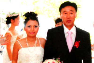 Trinh and her husband at their wedding ceremony in 2009 Trinh and her husband at their wedding ceremony in 2009