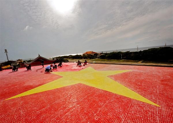 The ceramic mosaic national flag of Vietnam on Truong Sa Island. The ceramic mosaic national flag of Vietnam on Truong Sa Island.