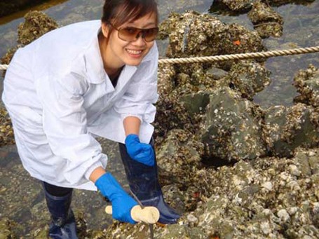 Hong taking sea water samples to check oil pollution Hong taking sea water samples to check oil pollution
