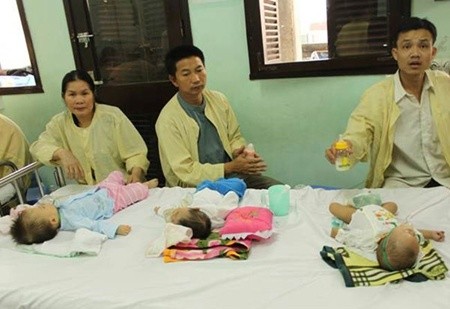 Three children share a bed at the National Paediatric Hospital. The hospital has been trying to cope with overcrowding for two months. — VNA Photo Three children share a bed at the National Paediatric Hospital. The hospital has been trying to cope with overcrowding for two months. — VNA Photo