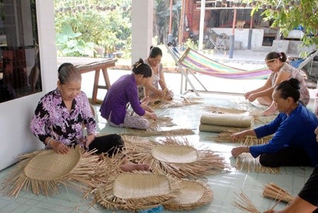 Women weave bamboo and rattan strips to make handicraft items under a pilot model for building new rural areas in HCM City's Xuan Thoi Thuong Commune. Creating employment opportunities is a main function of new rural areas. — VNA/VNS Photo Women weave bamboo and rattan strips to make handicraft items under a pilot model for building new rural areas in HCM City's Xuan Thoi Thuong Commune. Creating employment opportunities is a main function of new rural areas. — VNA/VNS Photo