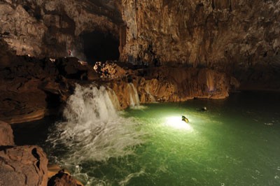 A waterfall in a recently discovered cave in Phong Nha-Ke Bang National Park A waterfall in a recently discovered cave in Phong Nha-Ke Bang National Park