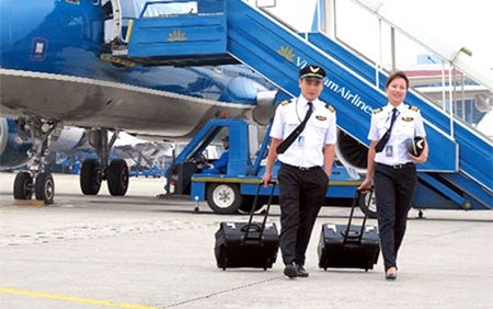 Vietnam Airlines' pilots on the runway. More than 100 employees have sought leave from the national carrier, prior to a go-slow strike demanding better payment. — Photo vef.vn Vietnam Airlines' pilots on the runway. More than 100 employees have sought leave from the national carrier, prior to a go-slow strike demanding better payment. — Photo vef.vn