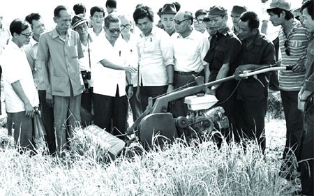 Prescient: Nguyen Van Linh visits a paddy field in southern province of Long An in 1982. He foresaw the path Viet Nam would have to take in globalising world. — File Photo