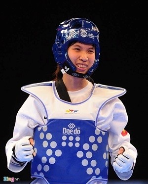 Martial arts fighter Truong Thi Kim Tuyen, who won a gold medal at the 28th Southeast Asian Games in Singapore last June, is expected to secure a berth for the 2016 Olympics in Brazil in August. — Photo zdn.vn Martial arts fighter Truong Thi Kim Tuyen, who won a gold medal at the 28th Southeast Asian Games in Singapore last June, is expected to secure a berth for the 2016 Olympics in Brazil in August. — Photo zdn.vn