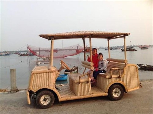 Caption 2: A bamboo car is developed from a battery-powered cart. The car designer and producer, Võ Tấn Tân, spent three months building the electric car into an environmentally-friendly vehicle. Caption 2: A bamboo car is developed from a battery-powered cart. The car designer and producer, Võ Tấn Tân, spent three months building the electric car into an environmentally-friendly vehicle.
