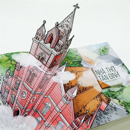 An illustration of the Tân Định Church. A 3D paper version of Notre-Dame Cathedral Basilica of Saigon. Photo courtesy of CI Team Four Văn Lang University students, Đặng Hoài Vũ, Nguyễn Vũ Tuấn Phát, Lương Thị Thanh Trúc and Phạm Thị Bích Thảo, created Sài Gòn Phố, a unique pop-up book that aims to introduce attractive destinations of HCM City to international visitors. An illustration of the Tân Định Church. A 3D paper version of Notre-Dame Cathedral Basilica of Saigon. Photo courtesy of CI Team Four Văn Lang University students, Đặng Hoài Vũ, Nguyễn Vũ Tuấn Phát, Lương Thị Thanh Trúc and Phạm Thị Bích Thảo, created Sài Gòn Phố, a unique pop-up book that aims to introduce attractive destinations of HCM City to international visitors.
