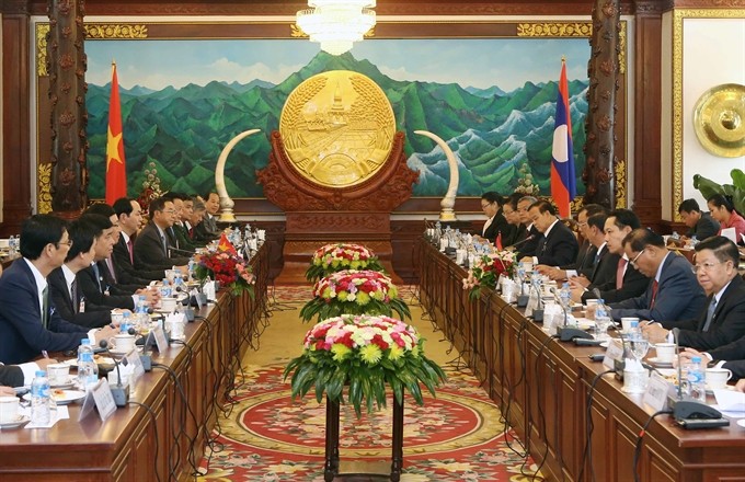 President Trần Đại Quang holds talks with Lao Party General Secretary and President Bounnhang Vorachith yesterday in Vientiane, Laos. (Photo: VNA/VNS) President Trần Đại Quang holds talks with Lao Party General Secretary and President Bounnhang Vorachith yesterday in Vientiane, Laos. (Photo: VNA/VNS)