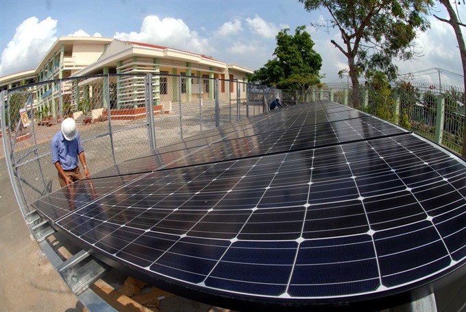 Solar energy panels installation at the secondary high school of Tan Nhut Commune outside HCM City. The commune has all criteria for new-style rural communes. — VNA/VNS Photo Manh Linh Solar energy panels installation at the secondary high school of Tan Nhut Commune outside HCM City. The commune has all criteria for new-style rural communes. — VNA/VNS Photo Manh Linh
