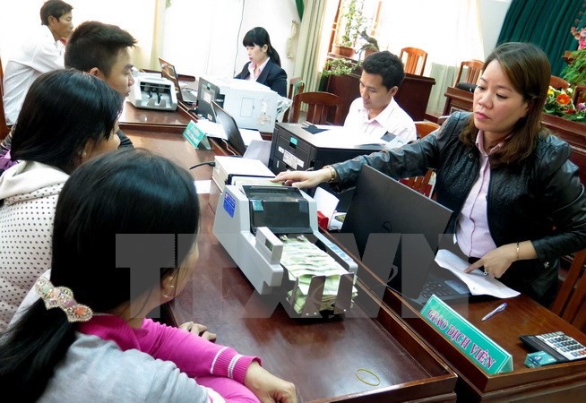 Poor households carry out procedures to borrow money from a branch of the VBSP at Tuy Phuoc district, Binh Thuan province. (Source: VNA) Poor households carry out procedures to borrow money from a branch of the VBSP at Tuy Phuoc district, Binh Thuan province. (Source: VNA)